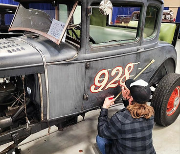 Hand painting speedway numbers on a model A hotrod