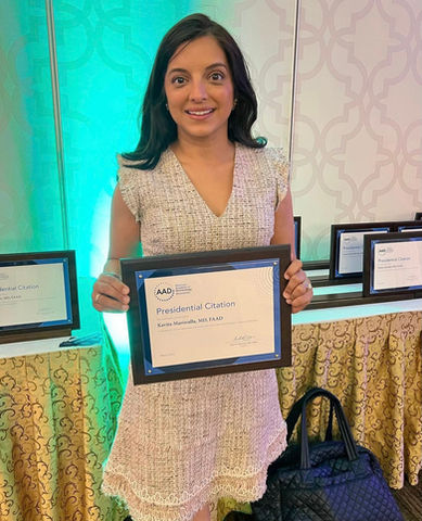 female doctor holding award