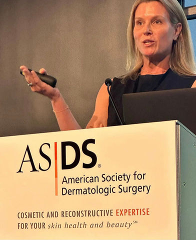 female doctor presenting at dermatology conference