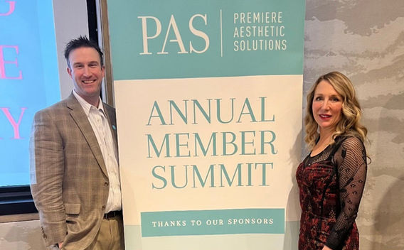 Doctors posing with summit sign