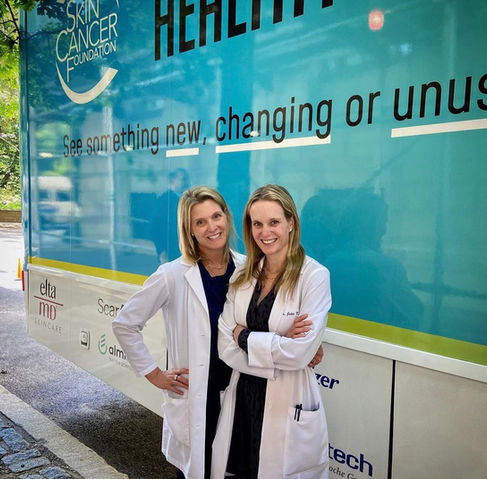 two female doctors smiling 