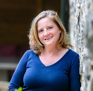 Monica Tanase-Coles, executive coach and leadership advisor, smiling confidently in professional headshot