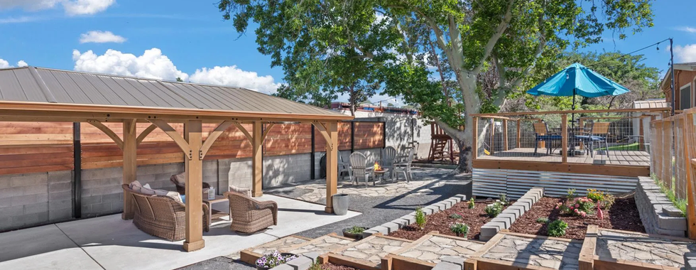 Beautiful new backyard oasis with terraced planters, gazebo, and play structure in Albuquerque's Northeast Heights