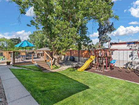 Landscaped backyard and playground in Northeast Heights, ABQ