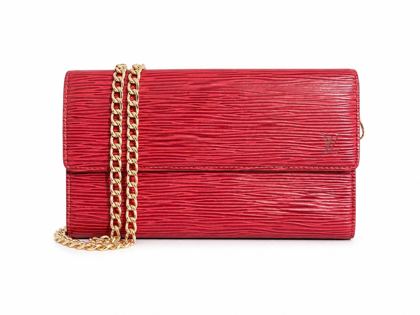 Red textured clutch with gold chain strap