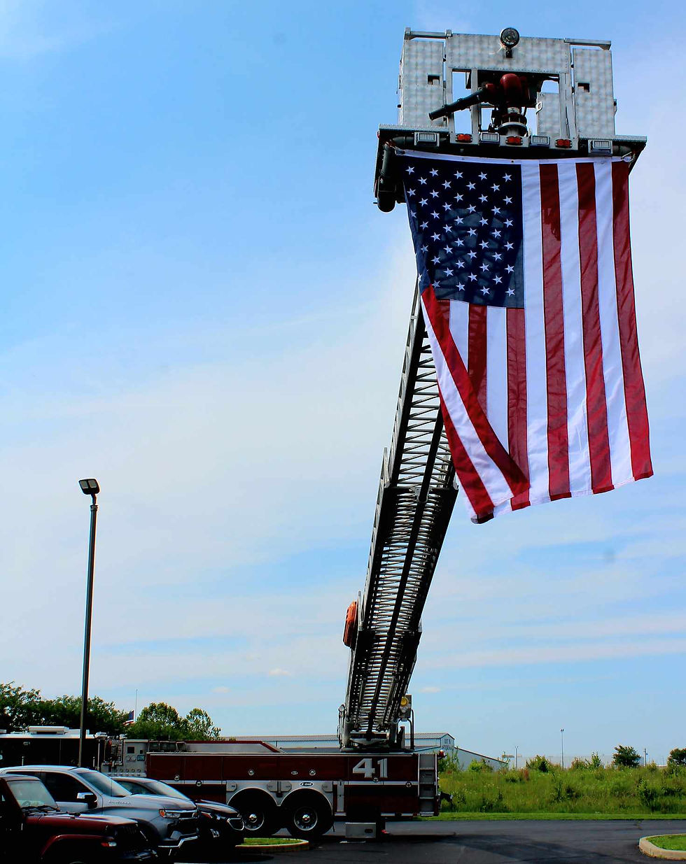 American flag displayed from a fire truck ladder at the ChampionZone grand opening in Edinburgh, Indiana