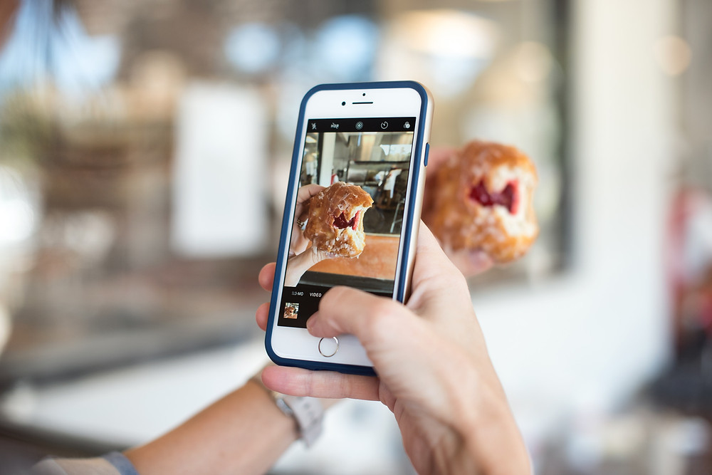 phone taking picture of food