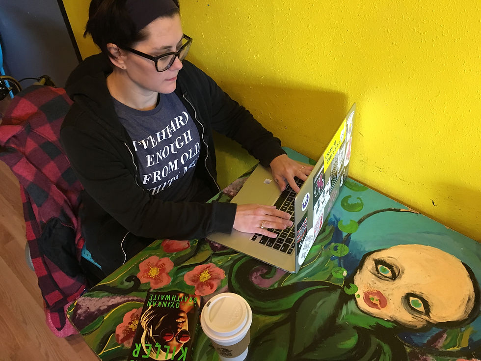Amy Tipton working in her happy place -- a favorite local coffee shop