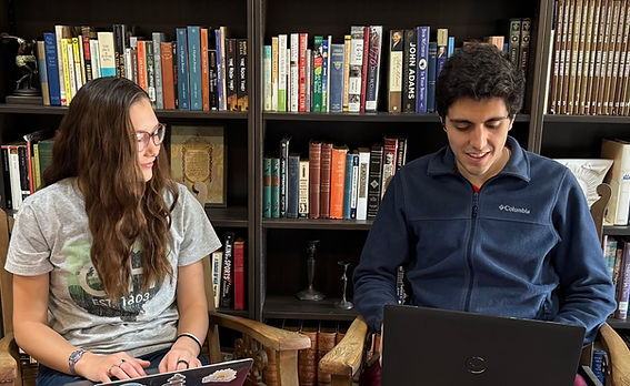 NDP YSA Female and Male in the library on computers