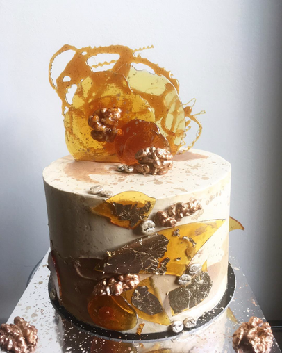 coffee, walnut praline, french meringue buttercream, caramel decorations