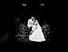 Black and white photo of bride and groom on staircase at Bourton Hall wedding in Rugby, natural documentary wedding photography