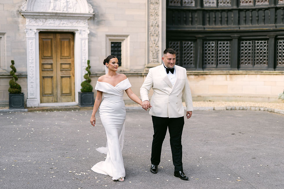 Bride and Groom outside chapel and Bourton Hall
