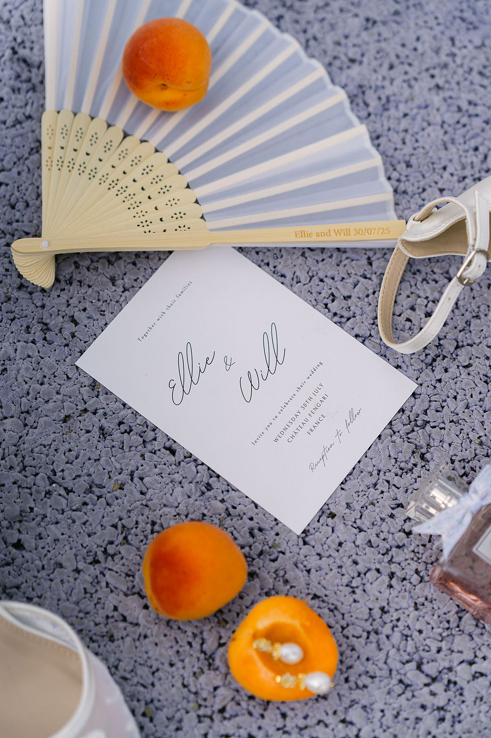 Wedding stationery and details with fan and fruit at Chateau Fengari in France, natural documentary wedding photography