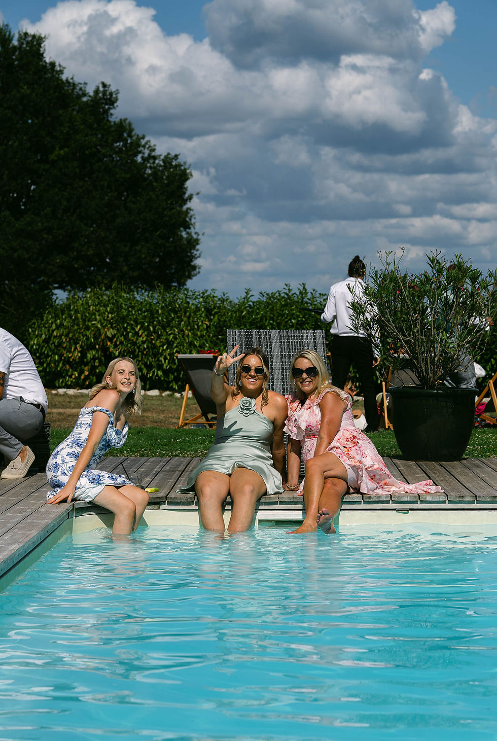 Guests relaxing by pool at Chateau Fengari wedding in France, natural documentary wedding photography