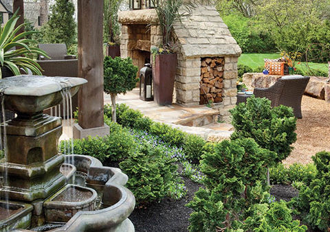 For the bi-level pergola that covers much of the 1,100-square-foot patio area, Spayde used solid cedar posts and a semi-transparent brown stain that allowed the wood grain to show. The extended cedar rafters also reference the pueblo-style elements of the house. 