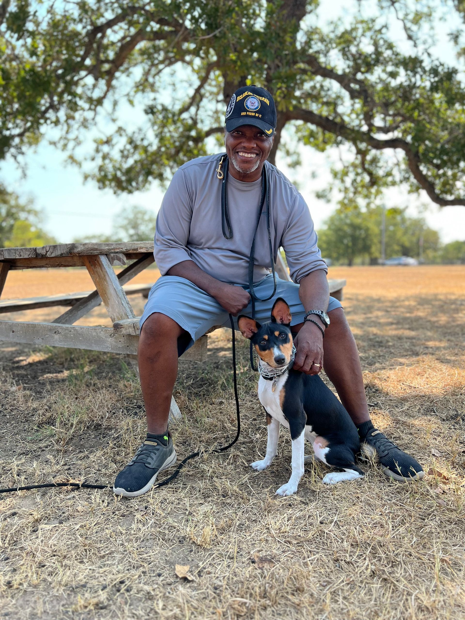 Owner and his Basenji with a dog training certificate in Bastrop, TX