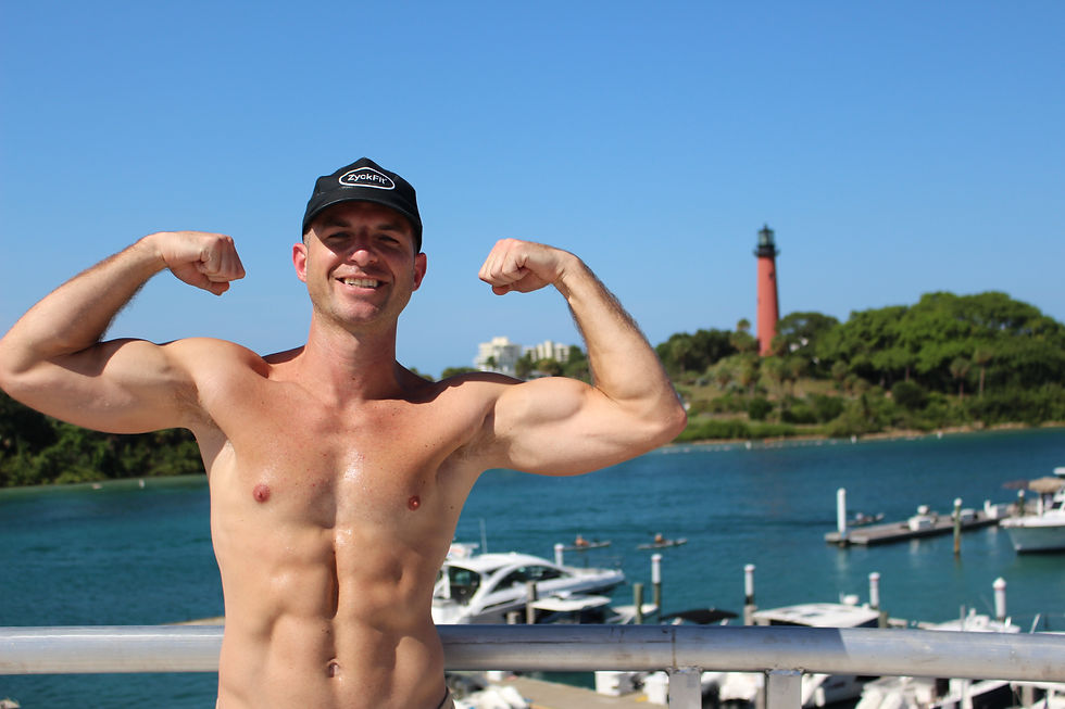ZyckFit CEO Tommy Rozycki bicep flex Jupiter Florida lighthouse inlet personal trainer life coach youth sports weight loss
