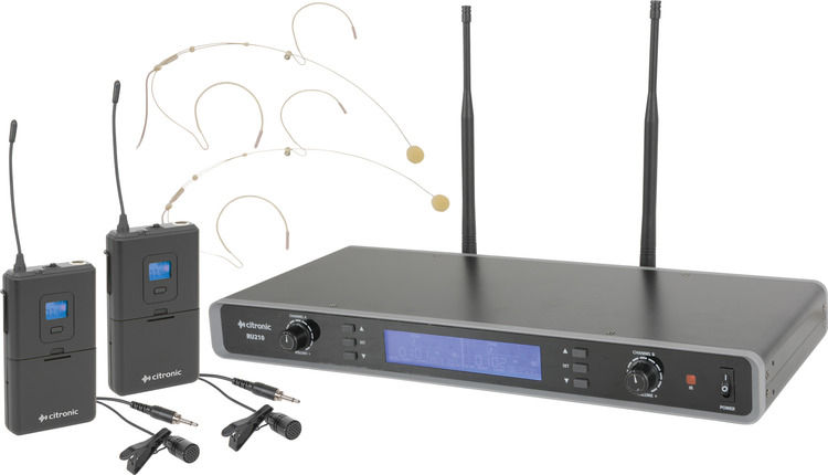Wireless microphone system with receiver and transmitters, visible text, for audio recording.