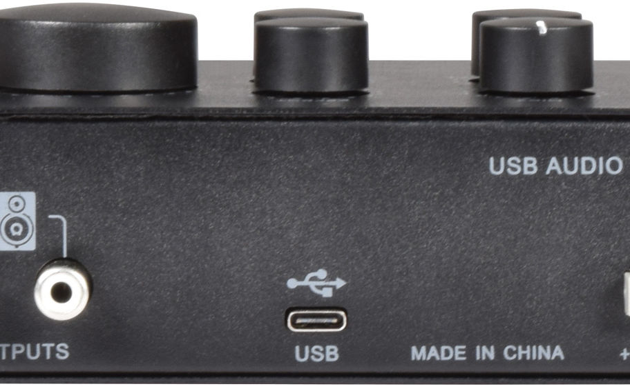 Black audio device with USB port, control knobs, and "USB" text visible.