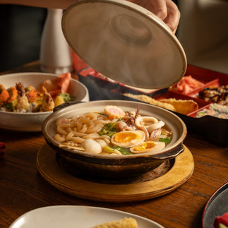 A delicious bowl of Japanese noodles with egg and vegetables, a classic ramen dish.