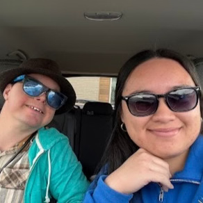 DeVonne 'Bon' Sablan, CBRS-CM at Visions Counseling & Education | CBRS in Boise seen posing for a photo with a client in her car.