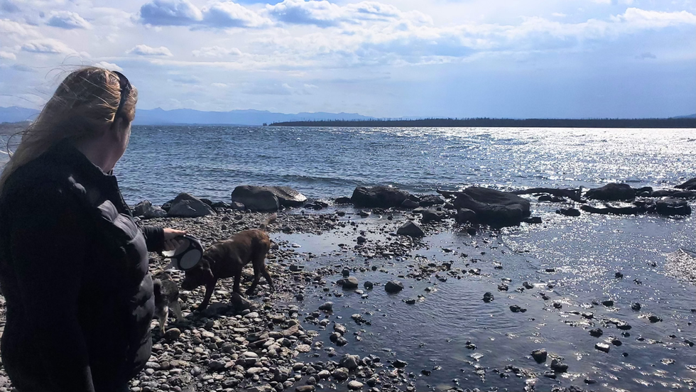 Felica Duce, LCPC-S Licensed Clinical Professional Counselor at Visions Counseling & Education | CBRS in Boise on a lake looking towards the horizon representing her hope to transform the mental health field in the Treasure Valley.
