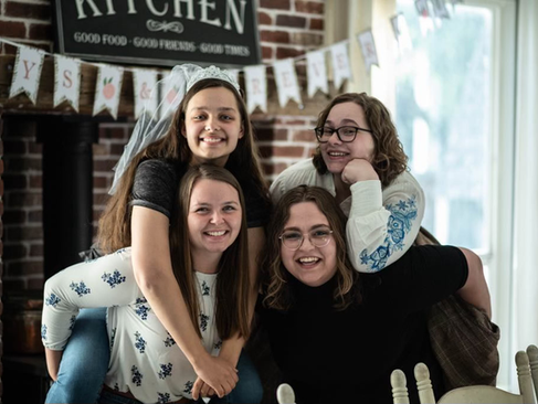 Portrait of Bryn Winegar, LPC Licensed Professional Counselor at Visions Counseling & Education in Boise with her family during a celebration.