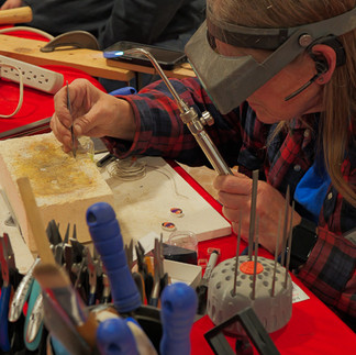 Artisan using a torch.