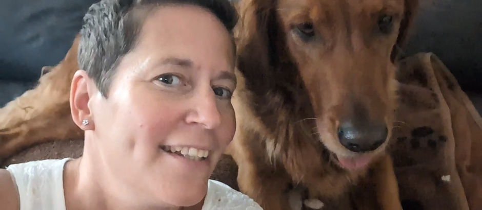 Portrait of Lulu Lay, LPC Intern, at Visions Counseling & Education in Boise with her Golden Retriever, Semba.