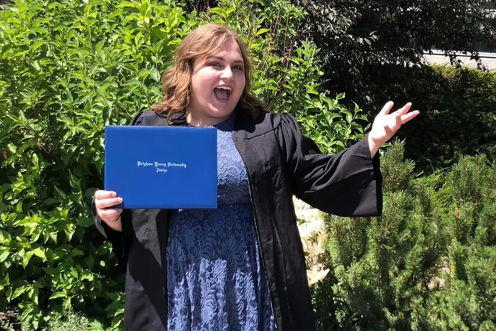 Portrait of Bryn Winegar, LPC at Visions Counseling & Education in Boise posing with her degree at BYU-Idaho graduation.