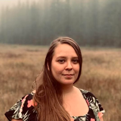 Portrait of KayLee Wangelin, Licensed Master of Social Work (LMSW) and Counselor at Visions Counseling & Education in Boise seen standing in a field.