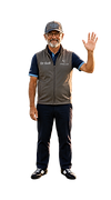 Dr. Golf, Chief Golf Instructor and Performance Specialist for the Critters Golf coaching team, smiling and waving while wearing a Critters Golf hat, polo, and vest, welcoming golfers to the "Meet the Coaches" page.