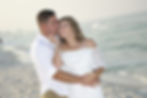 Cople embracing on the beach in the morning