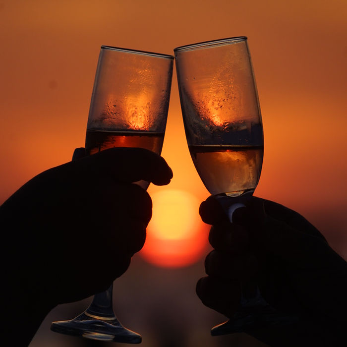 Champagne toast at sunset