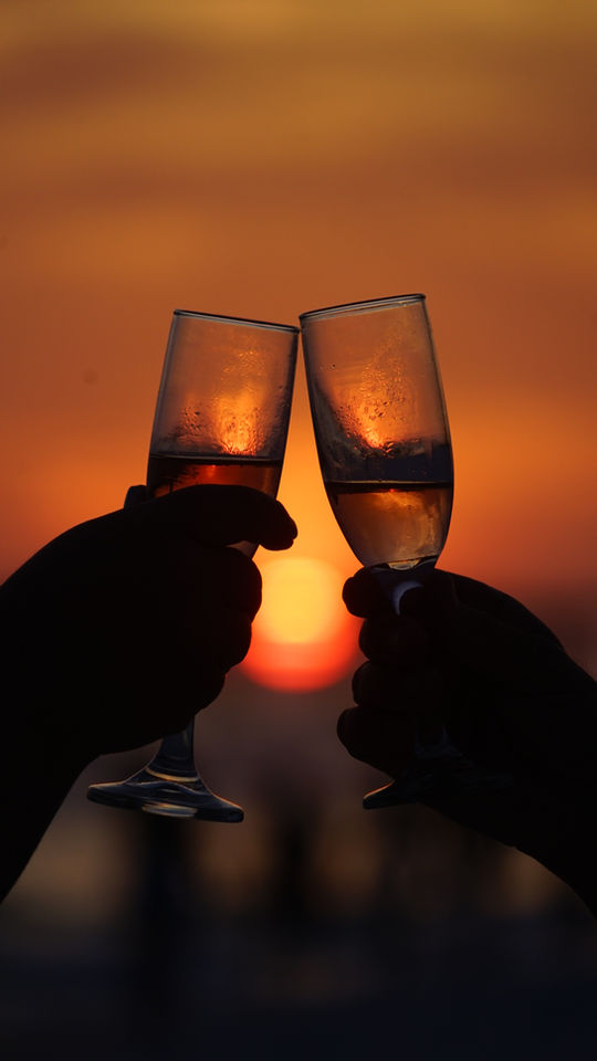 Champagne toast at sunset