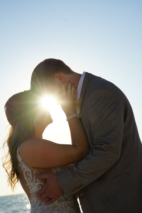 Couple embracing at sunset on the beach