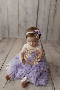 baby girl holding crown