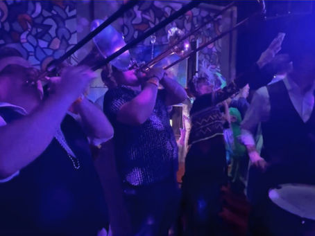 Brass band musicians performing a heartfelt musical tribute.