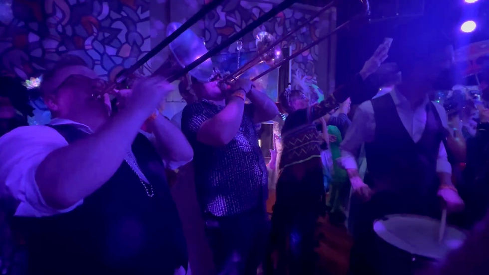 Brass band musicians performing a heartfelt musical tribute.