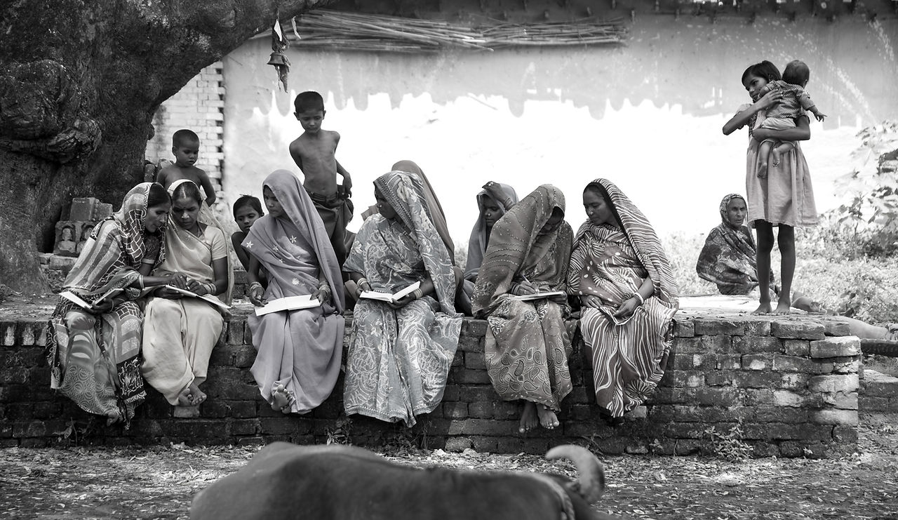 Rural women sitting below tree.jpg
