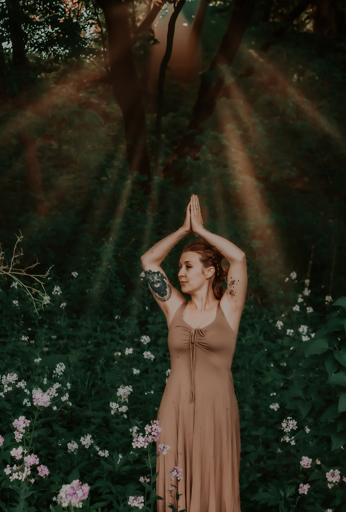 woman in wild flowers and sun light.jpg