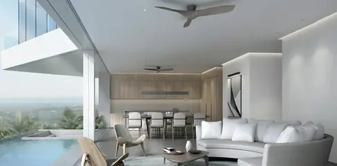 Open-plan villa interior at Butterfly Villas with direct connection to outdoor terrace, pool, and sea views.