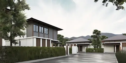 Residential street at Highland Villas showing villa blocks, privacy hedges, boundary walls, and mountain backdrop in Mae On