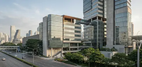 Urban perspective of Medical Center Bangkok concept showing podium-scale public frontage, stepped tower massing, curved glazed corners and integrated landscape terraces in Watthana, Bangkok.