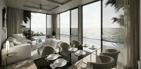 Modern open-plan living and kitchen interior of The Samui One Villas with minimalist finishes and integrated lighting