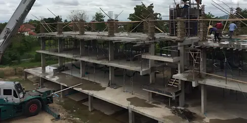 Reinforced concrete frame under construction at Miro Residences, illustrating slab layout, columns, and balcony cantilevers in Suthep, Chiang Mai.
