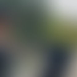 Woman running outdoors while pushing a stroller on a sunny path, part of a 5K training plan for moms in the Miles with Mama fitness series.