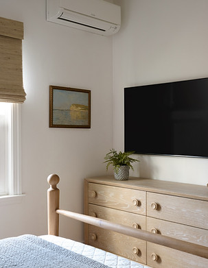 King bedroom with TV, streaming services, and lake views at Lake Shore Cottage