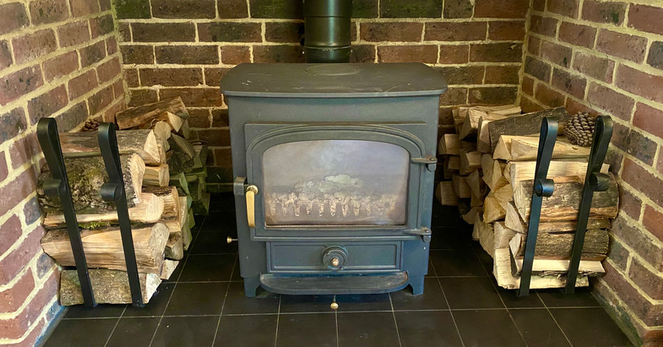 Forged Log Burner Accessories with brick wall surround 