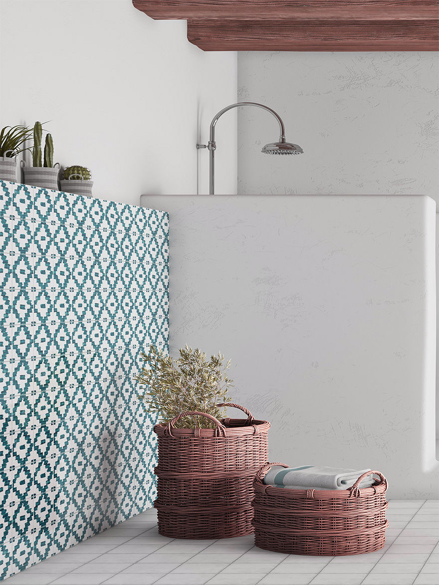 Bathroom with patterned teal tiles, wicker baskets, plants, and folded towels. Neutral and earthy tones create a serene ambiance.